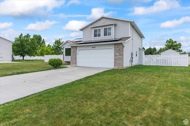 view of front of house with an attached garage, brick siding, and driveway