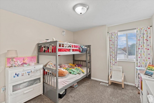 bedroom with carpet and baseboards