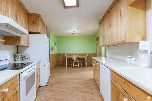 2147 N 3850 E, Eden, UT 84310 - kitchen featuring white appliances, under cabinet range hood, light wood-style flooring, light countertops, and wainscoting