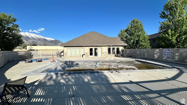 635 E 60 S Unit A-3, American Fork, UT 84003 - community pool featuring french doors, a mountain view, a fenced backyard, and a patio area