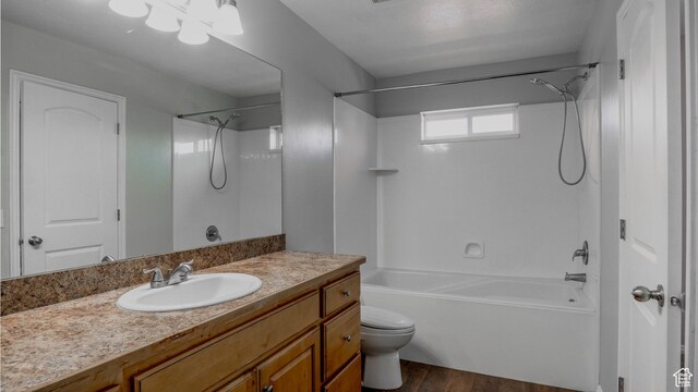 635 E 60 S Unit A-3, American Fork, UT 84003 - full bath with bathtub / shower combination, toilet, wood finished floors, and vanity