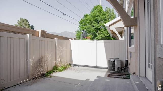 635 E 60 S Unit A-3, American Fork, UT 84003 - view of patio / terrace featuring central AC unit and a mountain view