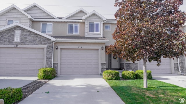 635 E 60 S Unit A-3, American Fork, UT 84003 - multi unit property with stone siding, stucco siding, concrete driveway, a garage, and a front yard