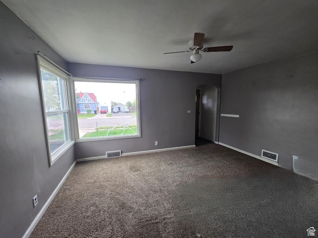 616 Jefferson St, Montpelier, ID 83254 - spare room featuring arched walkways, healthy amount of natural light, carpet, and ceiling fan