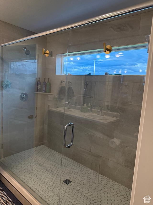 bathroom featuring a shower stall