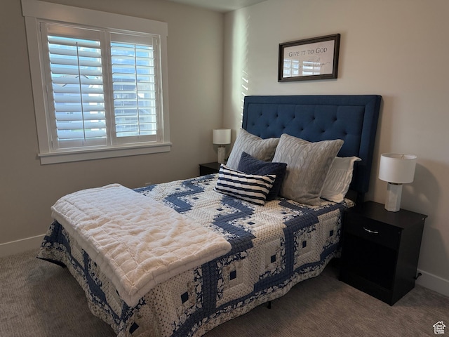 bedroom featuring carpet flooring and baseboards
