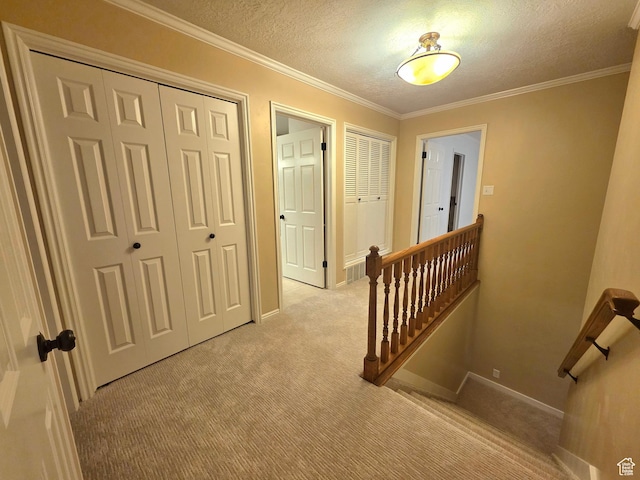 242 W 1100 S, Orem, UT 84058 - hallway featuring light carpet, an upstairs landing, a textured ceiling, crown molding, and baseboards