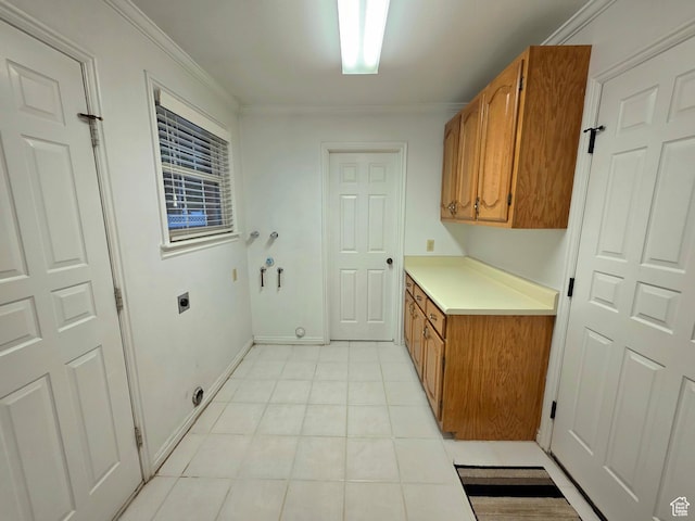 242 W 1100 S, Orem, UT 84058 - laundry room featuring cabinet space, electric dryer hookup, light tile patterned flooring, crown molding, and hookup for a washing machine