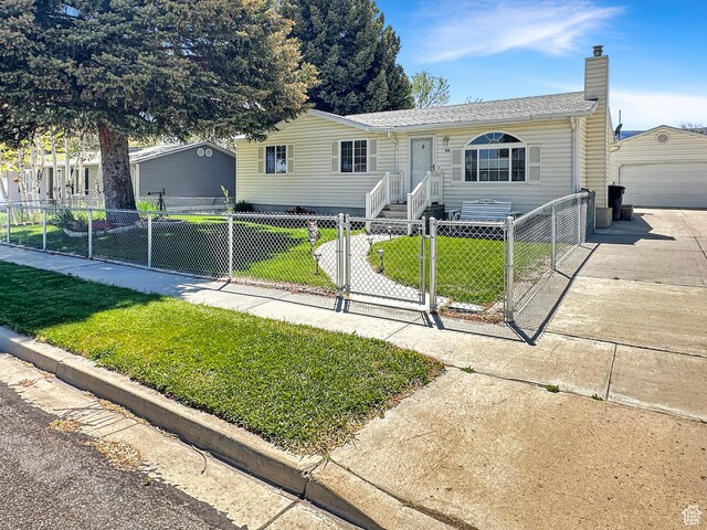 415 N Cedar Vw, Orangeville, UT 84537 - view of front of home featuring a chimney, a gate, an outbuilding, a detached garage, and driveway