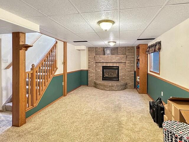 415 N Cedar Vw, Orangeville, UT 84537 - finished basement with stairs, a brick fireplace, carpet floors, and a drop ceiling