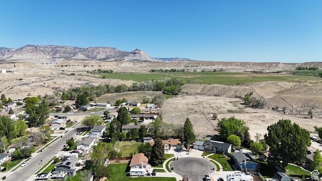 415 N Cedar Vw, Orangeville, UT 84537 - aerial view of property and surrounding area featuring a mountain backdrop and nearby suburban area
