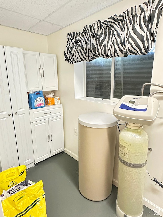 415 N Cedar Vw, Orangeville, UT 84537 - bathroom with finished concrete flooring, baseboards, and a drop ceiling