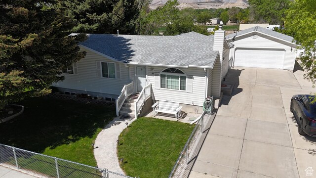 415 N Cedar Vw, Orangeville, UT 84537 - view of front of property with a garage, a shingled roof, a chimney, and concrete driveway
