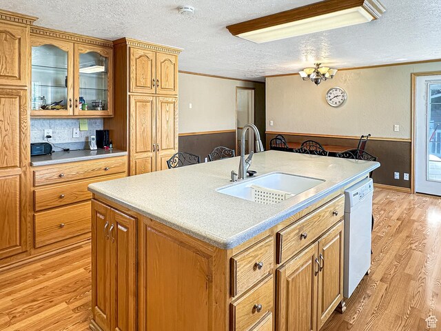 415 N Cedar Vw, Orangeville, UT 84537 - kitchen featuring a sink, a textured ceiling, white dishwasher, light wood-type flooring, and wainscoting