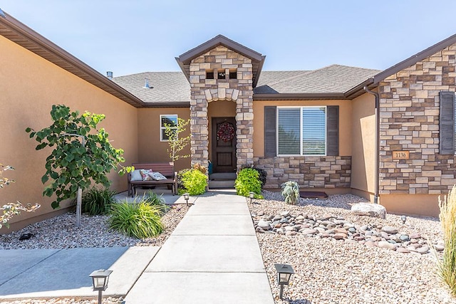 1136 S 4425 W, Cedar City, UT 84720 - doorway to property with stucco siding, stone siding, and a shingled roof