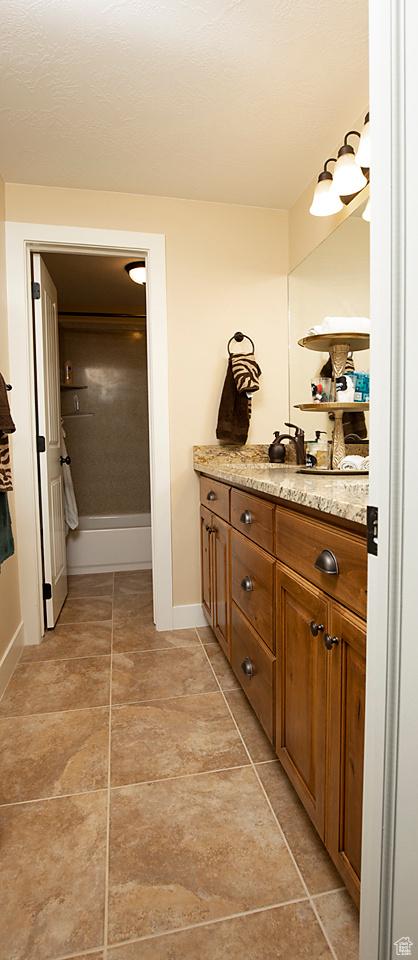 1136 S 4425 W, Cedar City, UT 84720 - bathroom with baseboards, vanity, and tile patterned flooring