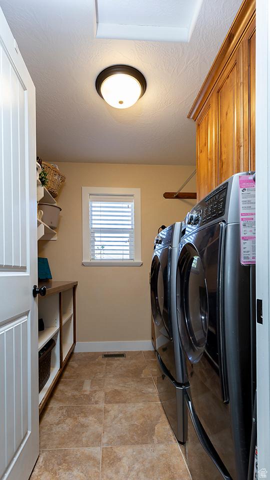 1136 S 4425 W, Cedar City, UT 84720 - laundry area with washer and clothes dryer, cabinet space, and baseboards