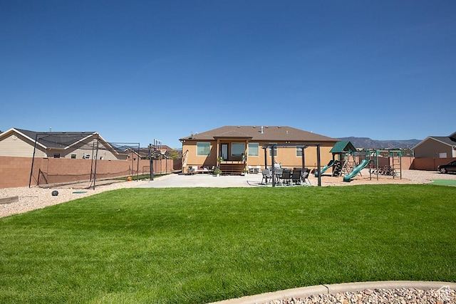 1136 S 4425 W, Cedar City, UT 84720 - rear view of house featuring a playground, entry steps, and a patio