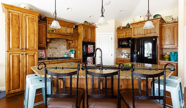 1136 S 4425 W, Cedar City, UT 84720 - kitchen featuring black appliances, a center island with sink, backsplash, decorative light fixtures, and recessed lighting