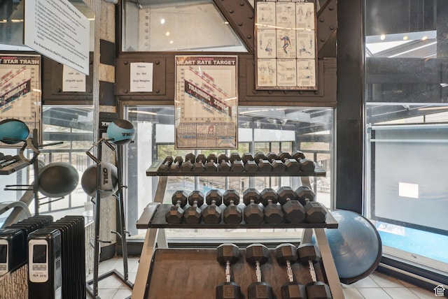workout area featuring tile patterned floors