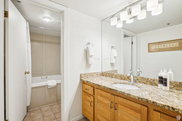 full bath with vanity, tile patterned flooring, and  shower combination