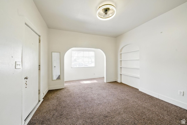 653 E Hollywood Ave, Salt Lake City, UT 84105 - carpeted empty room with built in shelves and baseboards