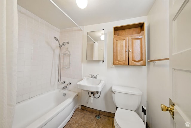 653 E Hollywood Ave, Salt Lake City, UT 84105 - bathroom featuring toilet, shower / bathtub combination with curtain, tile patterned flooring, baseboards, and a sink