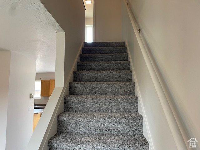 285 W 600 N Unit 3, Logan, UT 84321 - staircase featuring baseboards