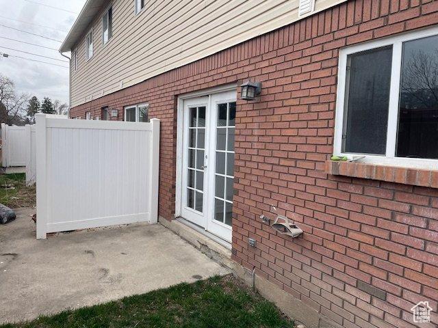 285 W 600 N Unit 3, Logan, UT 84321 - view of property exterior with brick siding, french doors, and a patio area