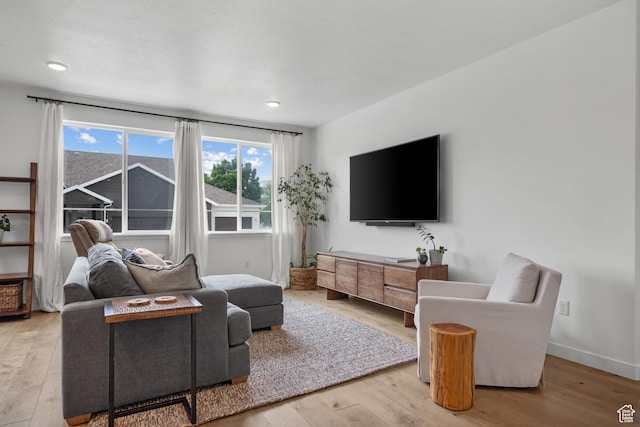 703 W Swinley Dr, Murray, UT 84123 - living room with wood finished floors, baseboards, and recessed lighting