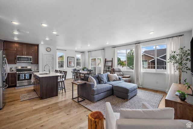 703 W Swinley Dr, Murray, UT 84123 - living area featuring light wood finished floors and recessed lighting