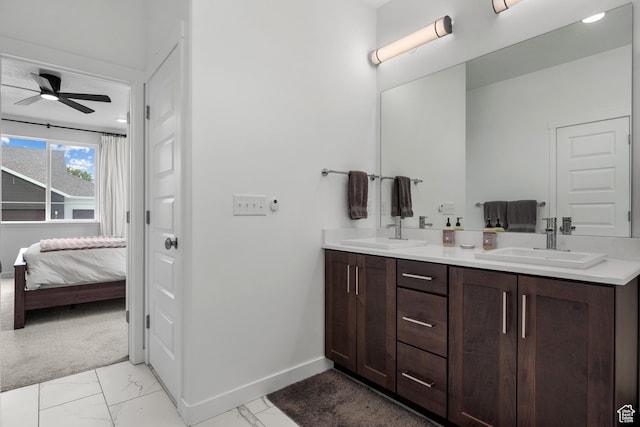 703 W Swinley Dr, Murray, UT 84123 - ensuite bathroom featuring marble finish flooring, baseboards, ceiling fan, and double vanity