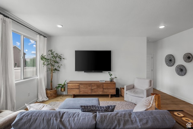 703 W Swinley Dr, Murray, UT 84123 - living area with wood finished floors, baseboards, and recessed lighting