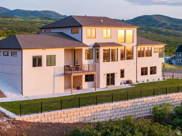1171 E 430 S, Santaquin, UT 84655 - rear view of house with a mountain view, stucco siding, a balcony, and a patio