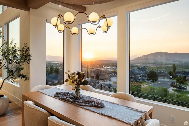 1171 E 430 S, Santaquin, UT 84655 - dining area featuring wood finished floors, a mountain view, baseboards, and a chandelier