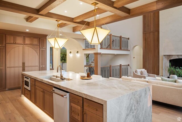 1171 E 430 S, Santaquin, UT 84655 - kitchen featuring a sink, light wood-style floors, coffered ceiling, beamed ceiling, and a spacious island