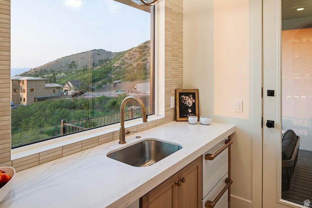1171 E 430 S, Santaquin, UT 84655 - kitchen featuring a sink, a mountain view, light stone countertops, and healthy amount of natural light