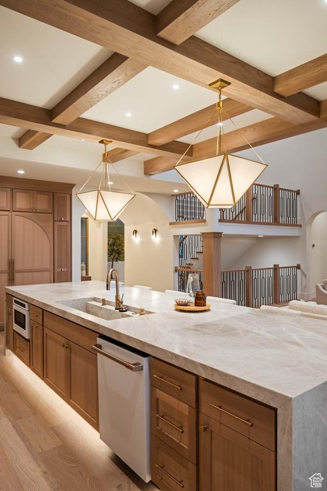1171 E 430 S, Santaquin, UT 84655 - kitchen featuring stainless steel appliances, coffered ceiling, a sink, beamed ceiling, and arched walkways