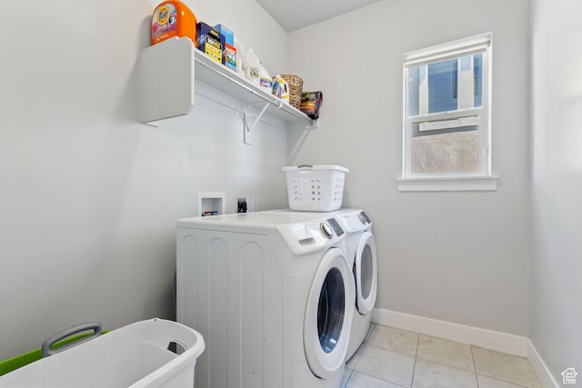 14949 S Billings Dr W Unit 119, Herriman, UT 84096 - washroom with washer and clothes dryer, baseboards, and light tile patterned flooring