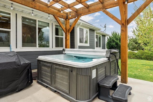 view of patio with a hot tub and grilling area