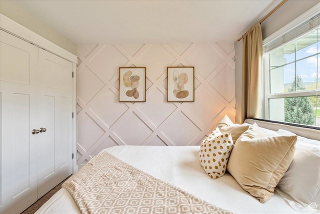 bedroom with a decorative wall