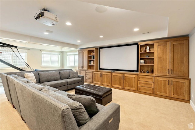 home theater with recessed lighting and light carpet