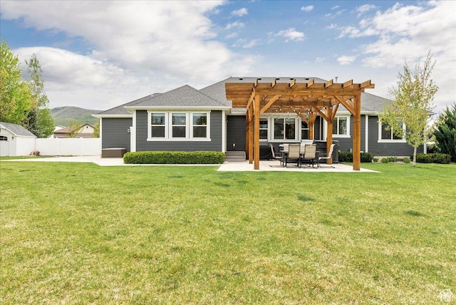 back of house with a pergola, a patio, and a mountain view