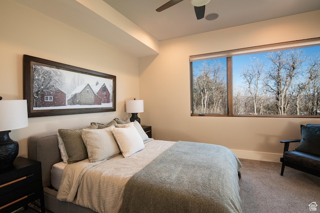 bedroom with carpet flooring, a ceiling fan, and baseboards