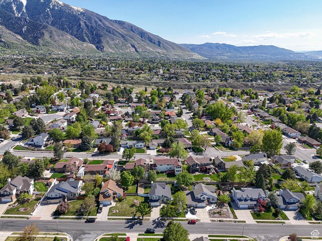 aerial view of residential area featuring mountains