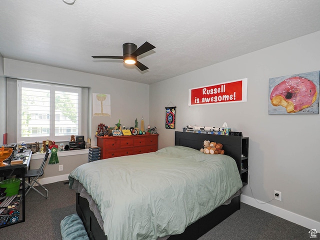 bedroom with dark carpet, baseboards, and a ceiling fan