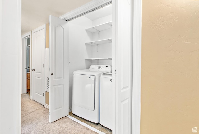 684 S 2150 W Unit 203, Pleasant Grove, UT 84062 - washroom featuring washing machine and dryer, light carpet, and a textured wall