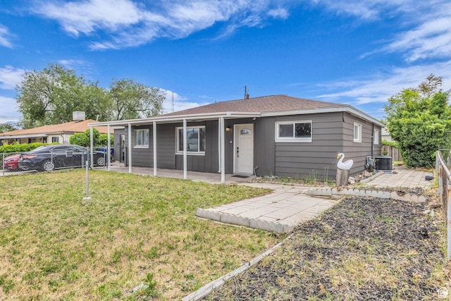 4587 W 5100 S, Kearns, UT 84118 - view of front of house featuring a patio area, cooling unit, and a shingled roof