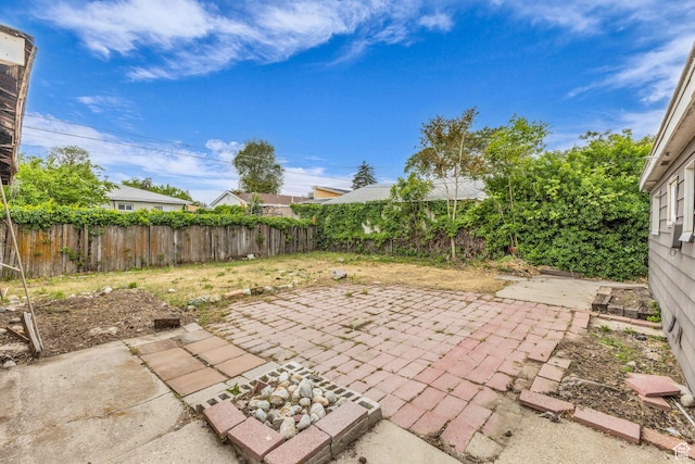 4587 W 5100 S, Kearns, UT 84118 - fenced backyard featuring a patio