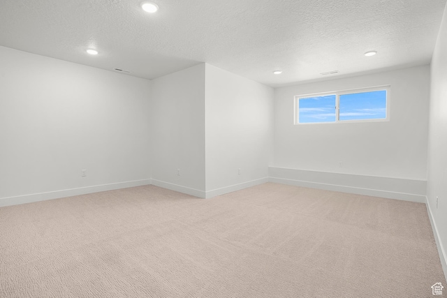1631 W Century Ln Unit A, Mapleton, UT 84664 - spare room with a textured ceiling, light colored carpet, baseboards, and recessed lighting